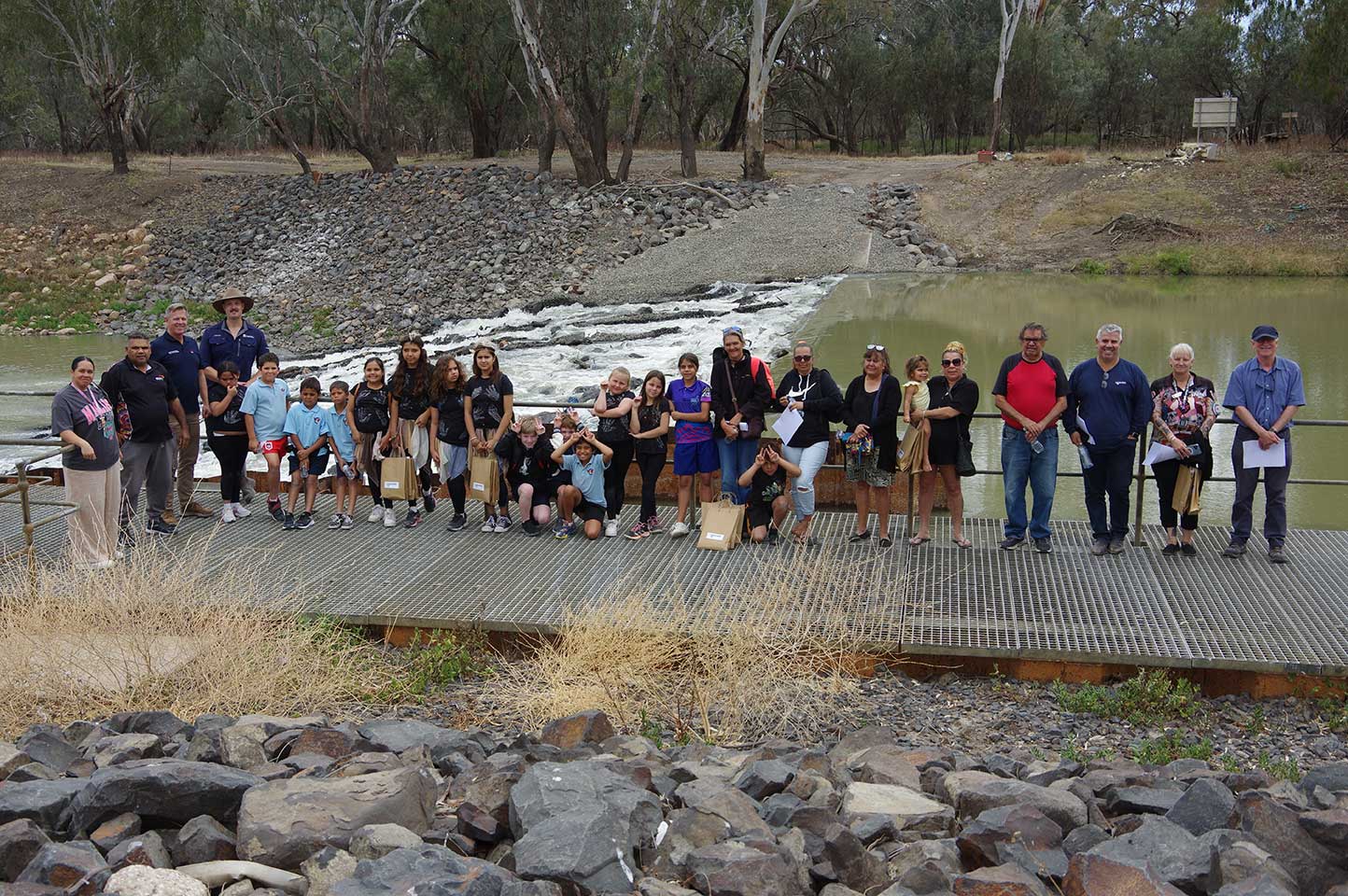 Group photo taken after tours of the weir and fishway